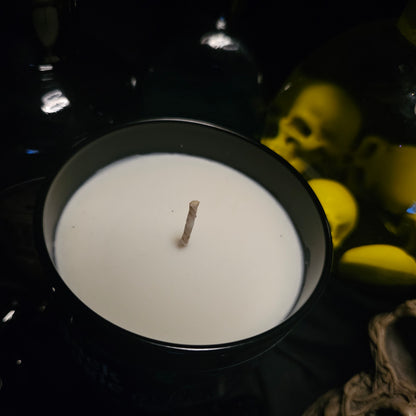 A close up of the top of a candle, on a dark background 