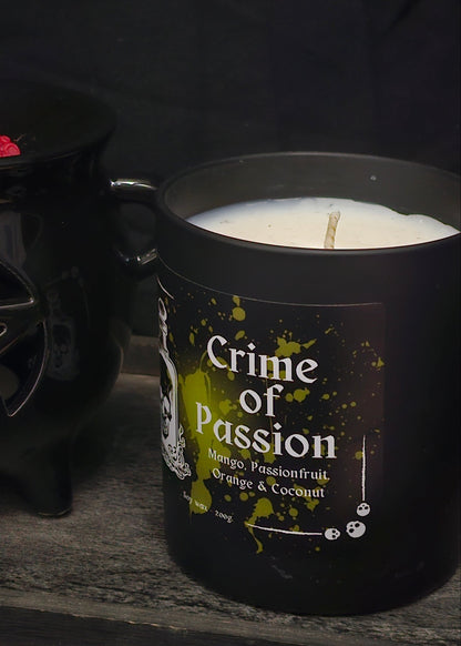 A candle housed in a black jar labelled "Crime of Passion; mango, passionfruit, Orange & Coconut"
