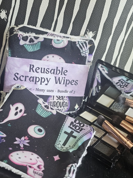 Makeup brushes with a pack of reusable scrappy wipes on a striped surface
