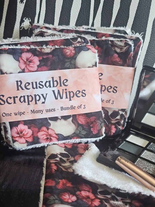 Reusable Make up wipes, with floral and skull design laying beside a makeup pallet 