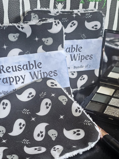 Reusable wipes with ghost pattern packaging on a black background