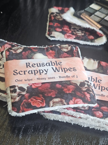 Reusable scrappy wipes / reusable makeup wipes with skull and rose pattern and visible brand label on a dark background