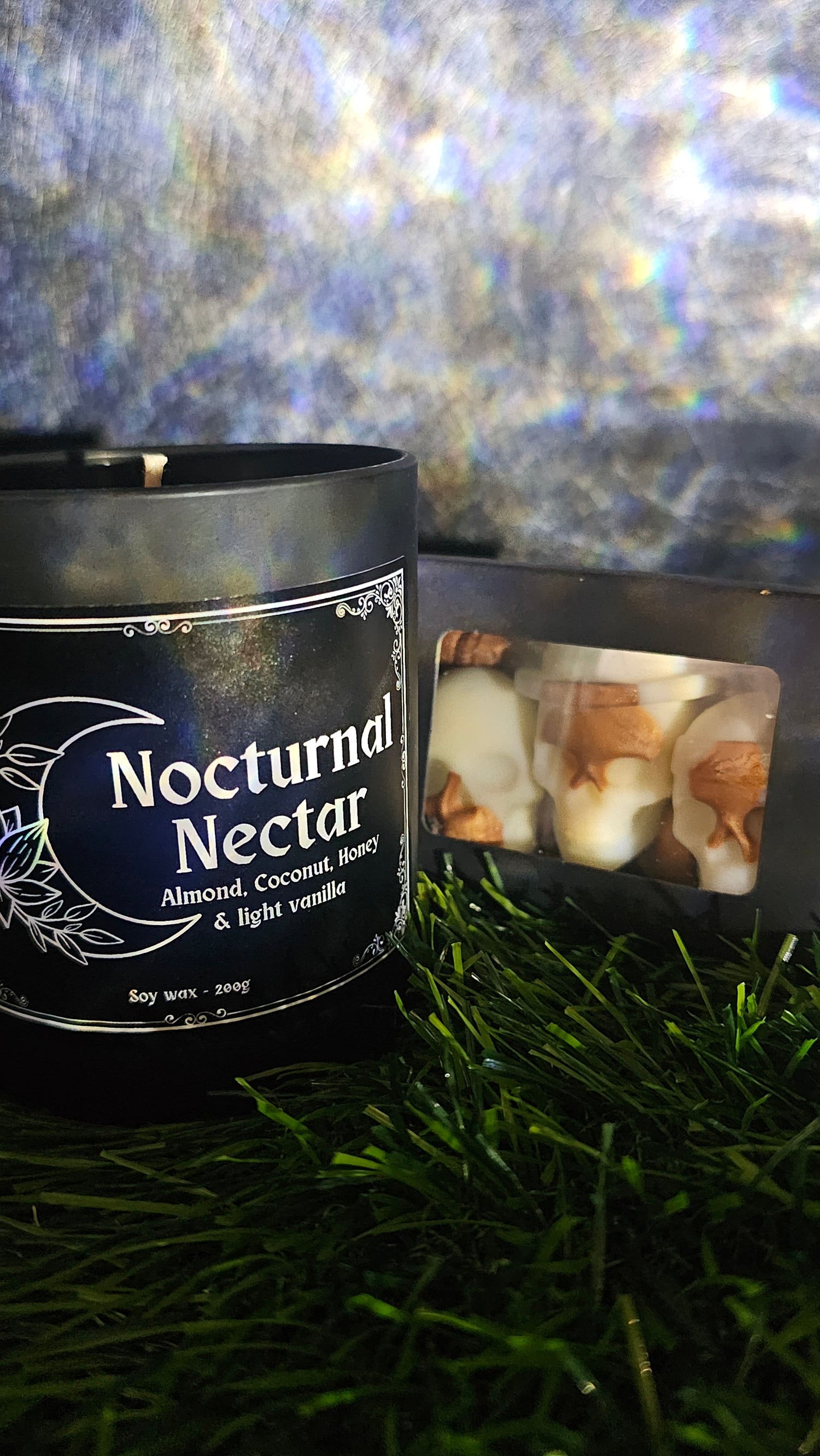 Nocturnal Nectar product packaging on a textured surface with grass in the background
