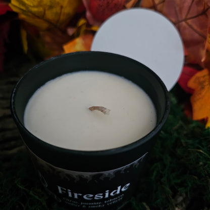 Overhead veiw of a candle in a black jar 