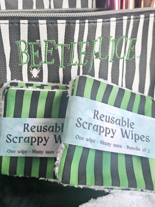 Reusable scrappy wipes sat in front of  a striped Beetlejuice makeup bag