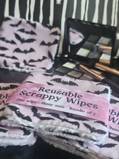Reusable scrappy wipes with bat design  on a pink background