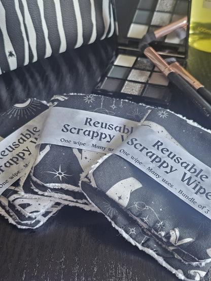 Reusable scrappy wipes with a black and white design on a dark surface