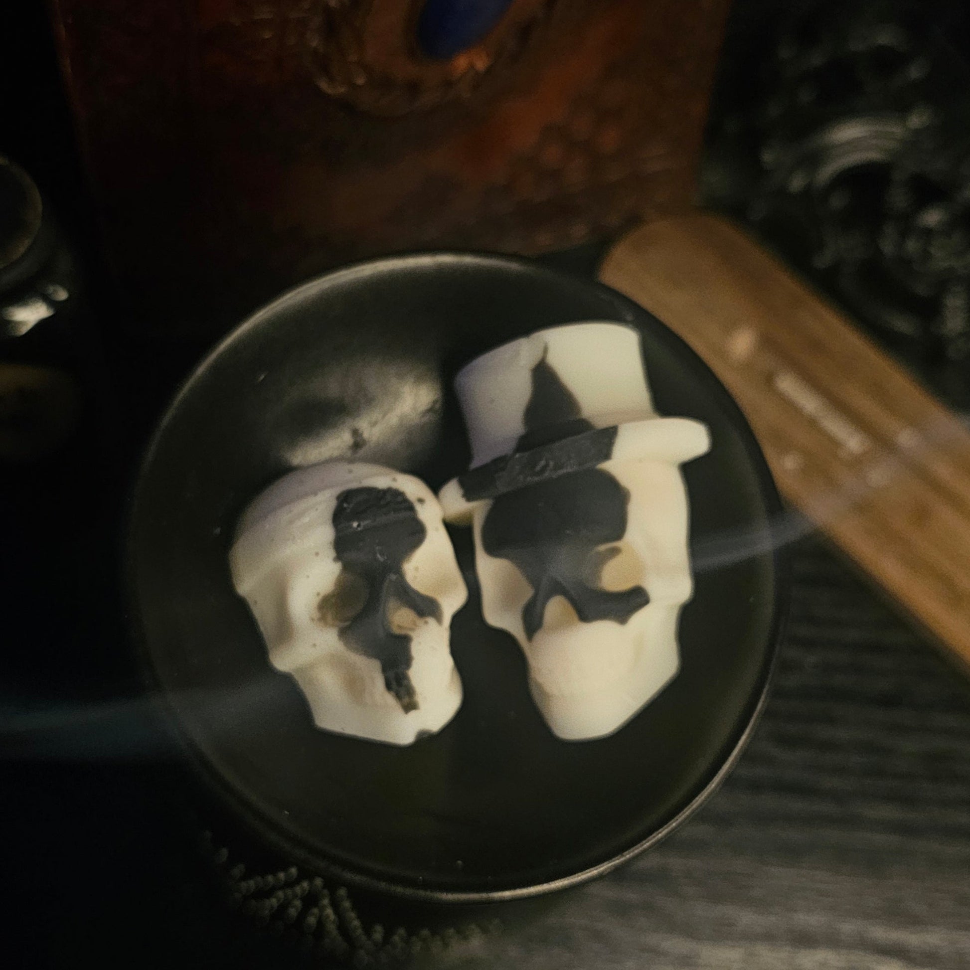 2 Skull shaped wax melts in a burner 