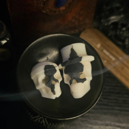 2 Skull shaped wax melts in a burner 